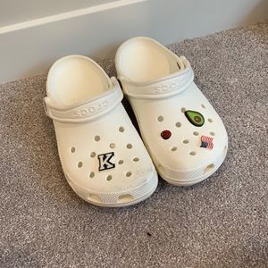White slide on crocs with gibbets